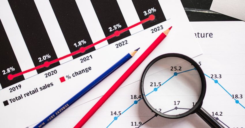 Infographics - lack Round Magnifying Glass on White Printer Paper